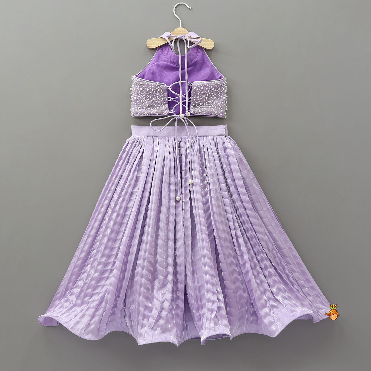 Pre Order: Stunning Criss-Cross Back Knot Top And Crushed Sheen Lehenga With Matching Hair Tie