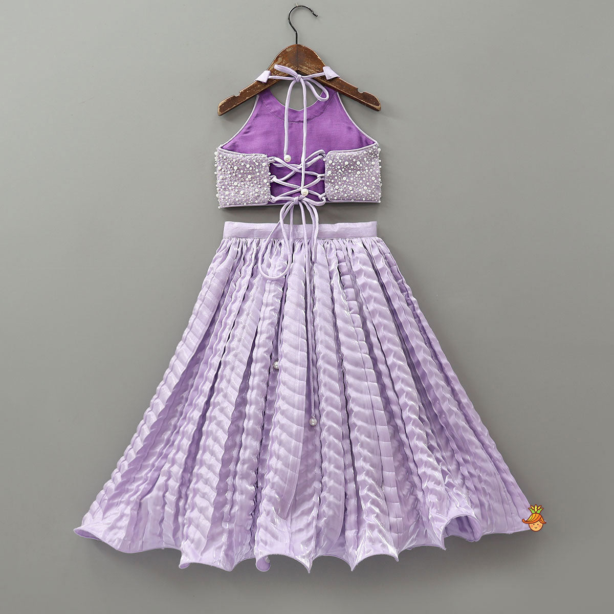 Pre Order: Stunning Criss-Cross Back Knot Top And Crushed Sheen Lehenga With Matching Hair Tie