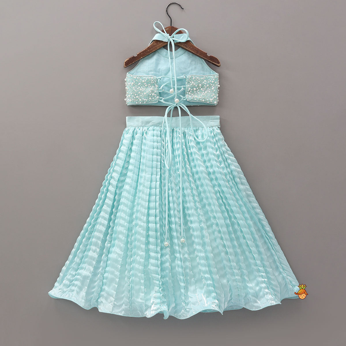 Stunning Criss-Cross Back Knot Top And Crushed Sheen Lehenga With Hair Tie