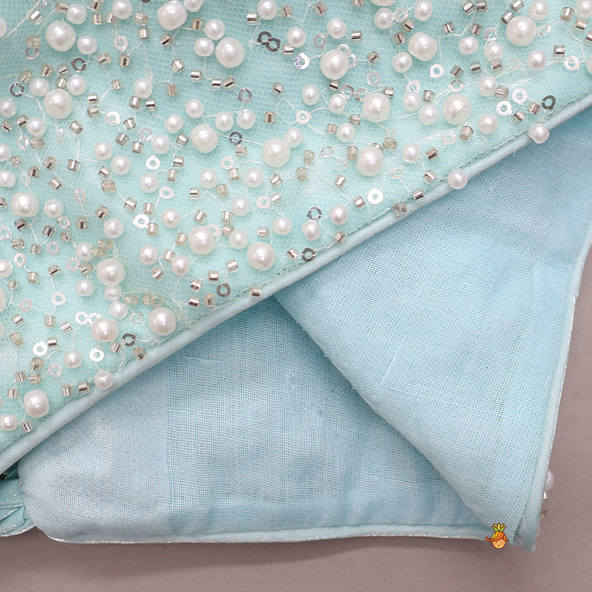 Stunning Criss-Cross Back Knot Top And Crushed Sheen Lehenga With Hair Tie