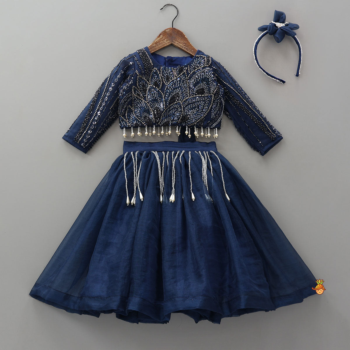 Pre Order: Heavy Embroidered Drape Crop Top And Lehenga With Matching Hair Band