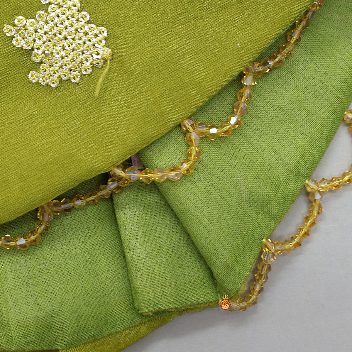 Pre Order: Organza Top And Lehenga With Handmade Tassel Detailing