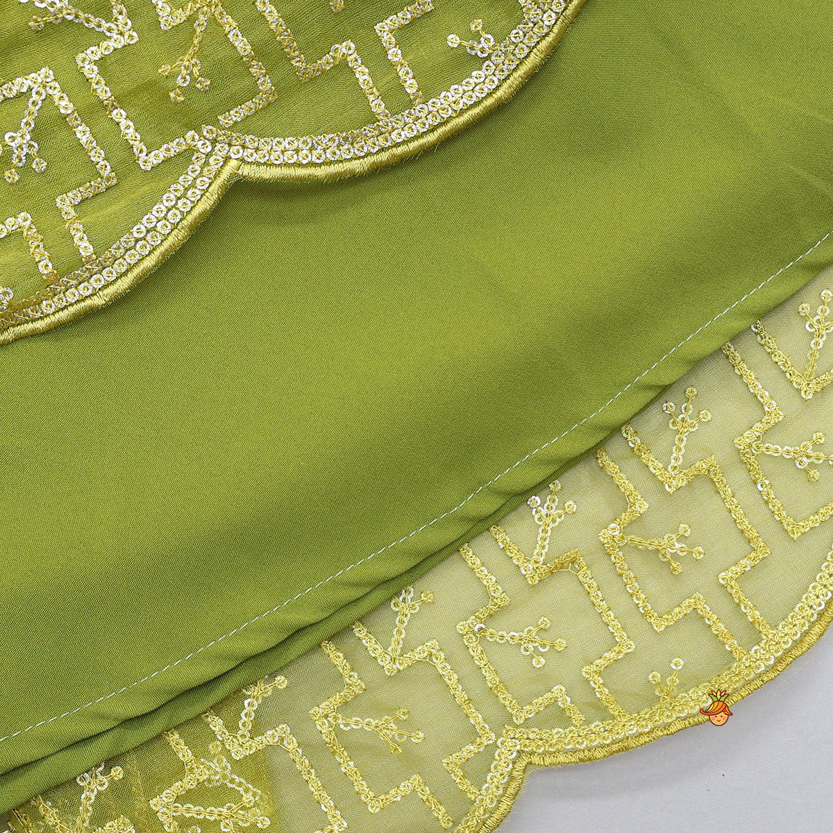 Pre Order: Organza Top And Lehenga With Handmade Tassel Detailing