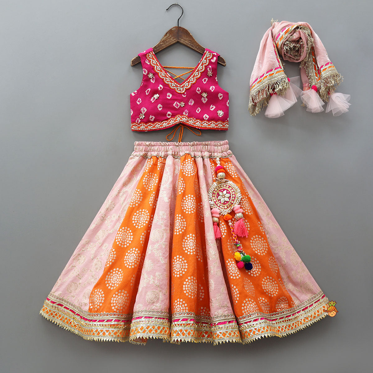 Pre Order: Criss-Cross Knot Tie-Up Crop Top And Lehenga With Sheen Dupatta