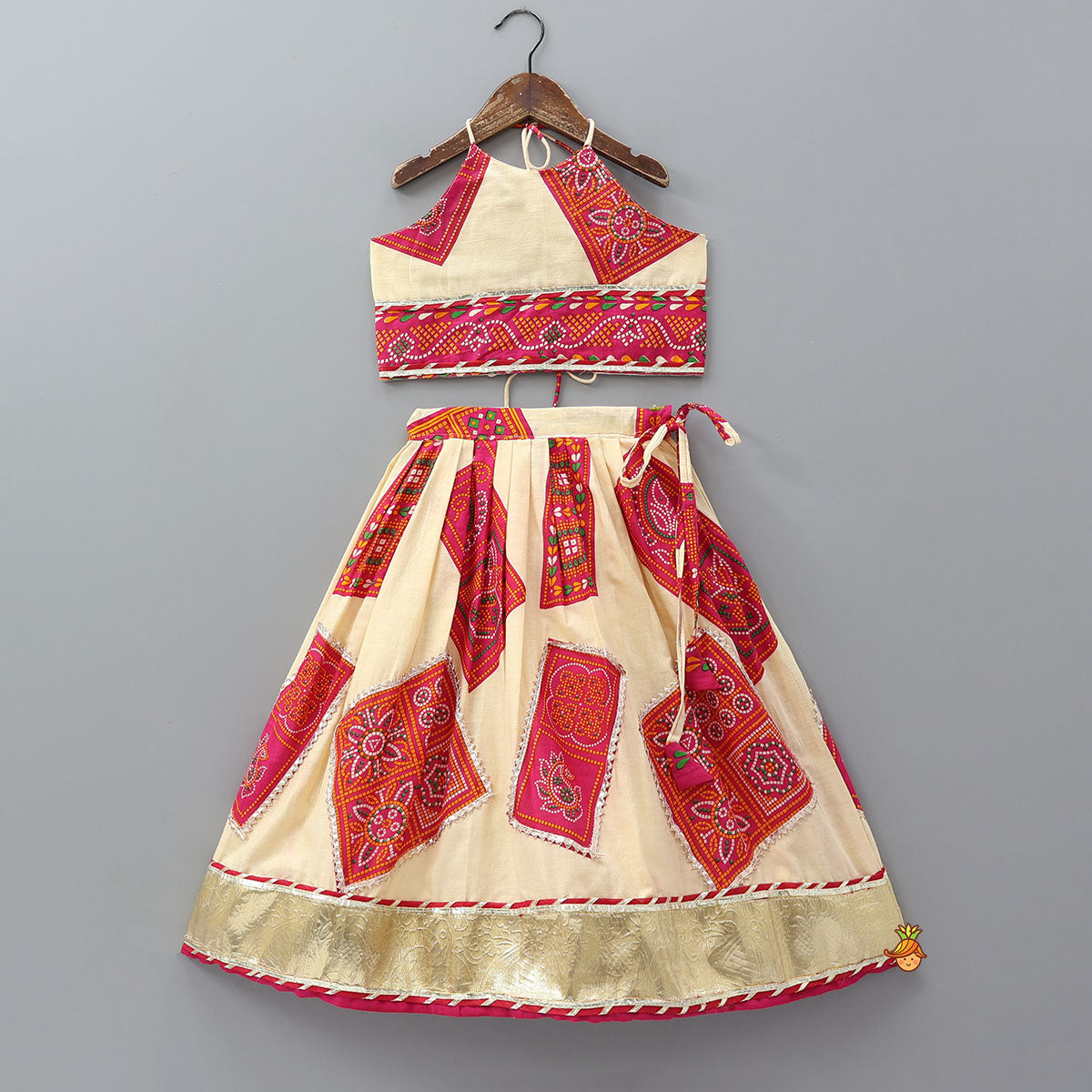 Pre Order: Tie-Up Back Bandhani-Printed Top And Lehenga