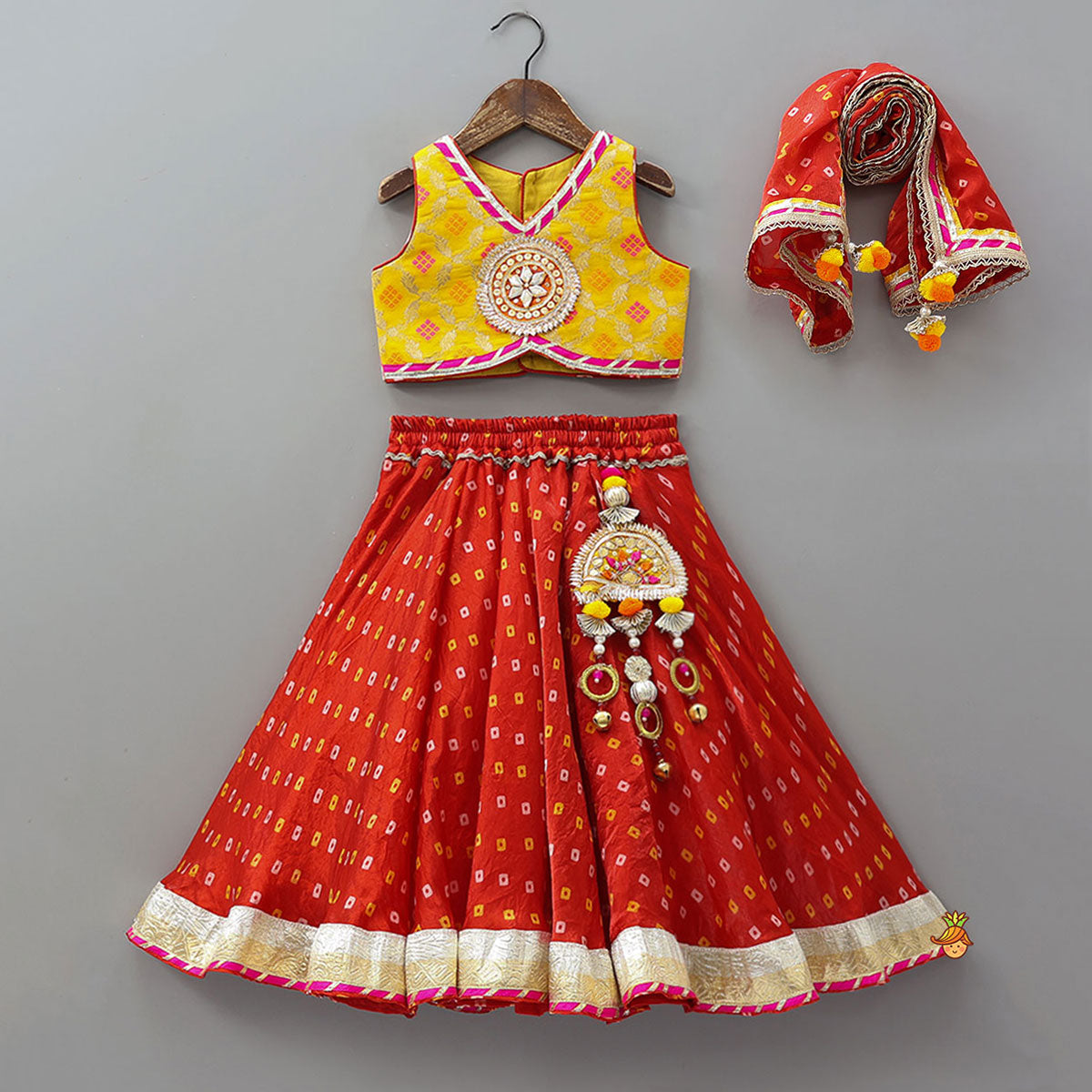 Pre Order: Stunning Crop Top And Tassel Detailed Bandhani Printed Sheen Lehenga With Dupatta