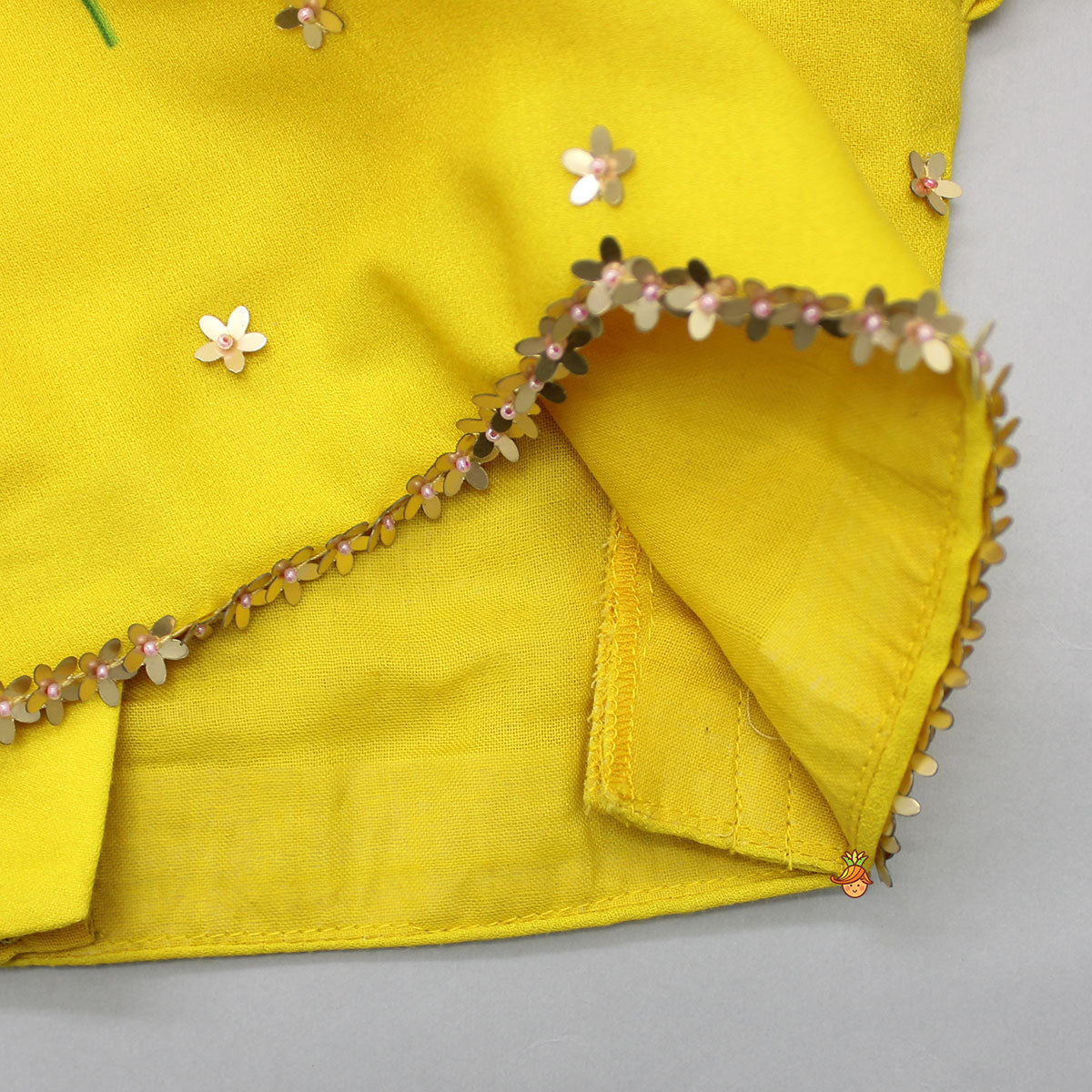 Pre Order: Floral Sequined Yellow Top And Cow Tassels Enhanced Pleated Lehenga With Dupatta