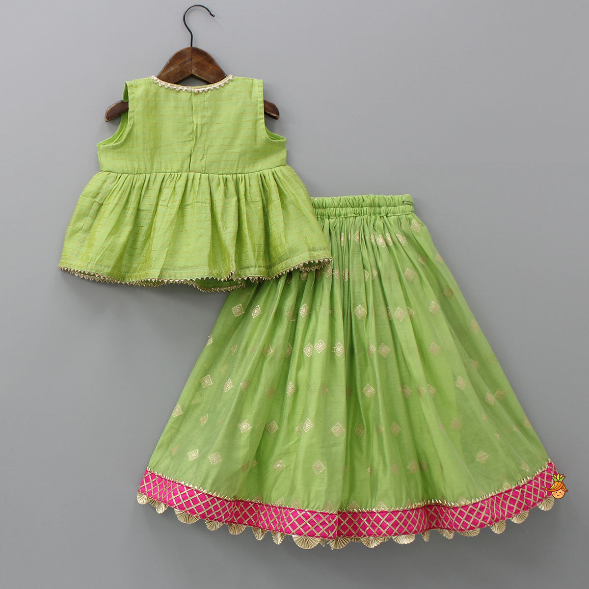 Pre Order: Contrasting Potli Buttons Detail Leaf Green Top And Gota Tassels Enhanced Lehenga