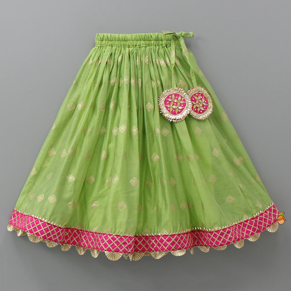 Pre Order: Contrasting Potli Buttons Detail Leaf Green Top And Gota Tassels Enhanced Lehenga