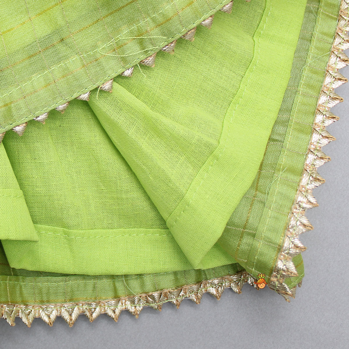 Pre Order: Contrasting Potli Buttons Detail Leaf Green Top And Gota Tassels Enhanced Lehenga