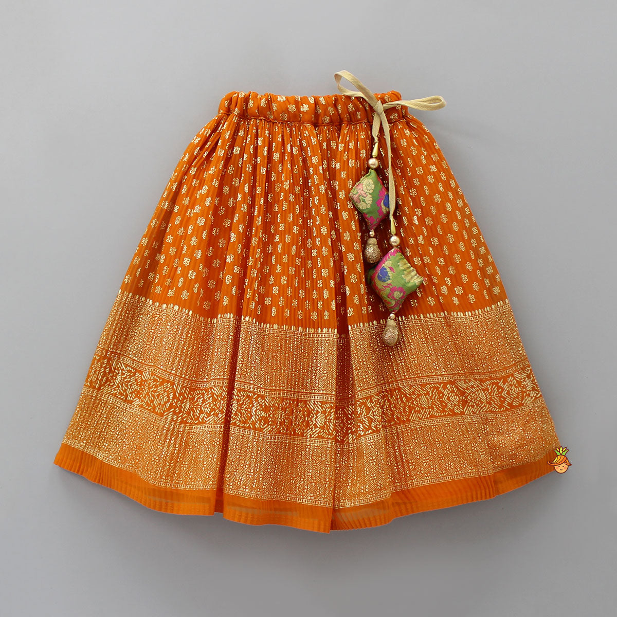 Pre Order: Rust Orange Pleated Georgette Top And Lehenga With Hair Clip