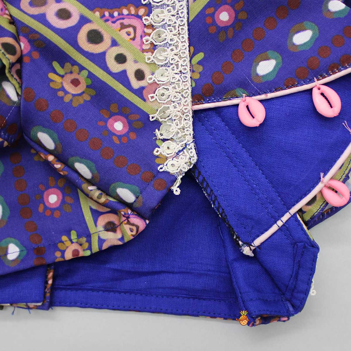 Pre Order: Layered Sleeves Blue Top And Fabric Flower Tassels Enhanced Lehenga With Purple Net Dupatta