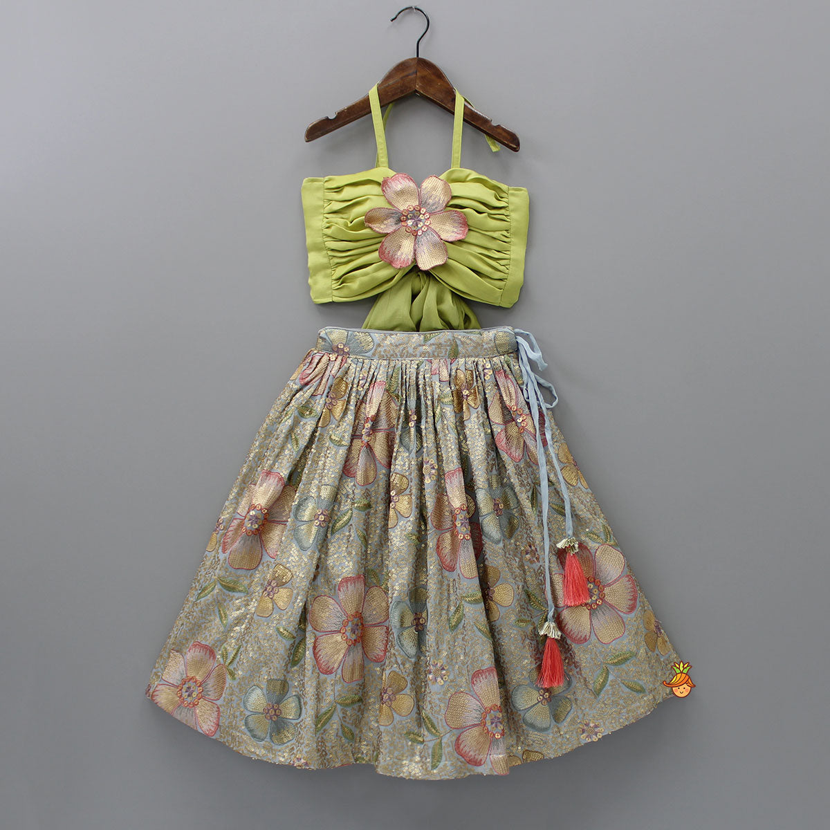 Pre Order: Back Knot Detail Stylish Green Floral Top And Heavy Sequins Embroidered Lehenga With Bow Hair Clip