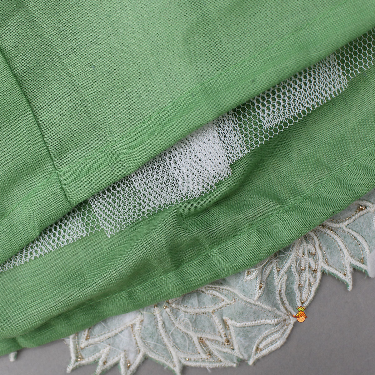 Pre Order: Pleated Neckline Green Shimmery Top And Fringes Tassels Enhanced Lehenga