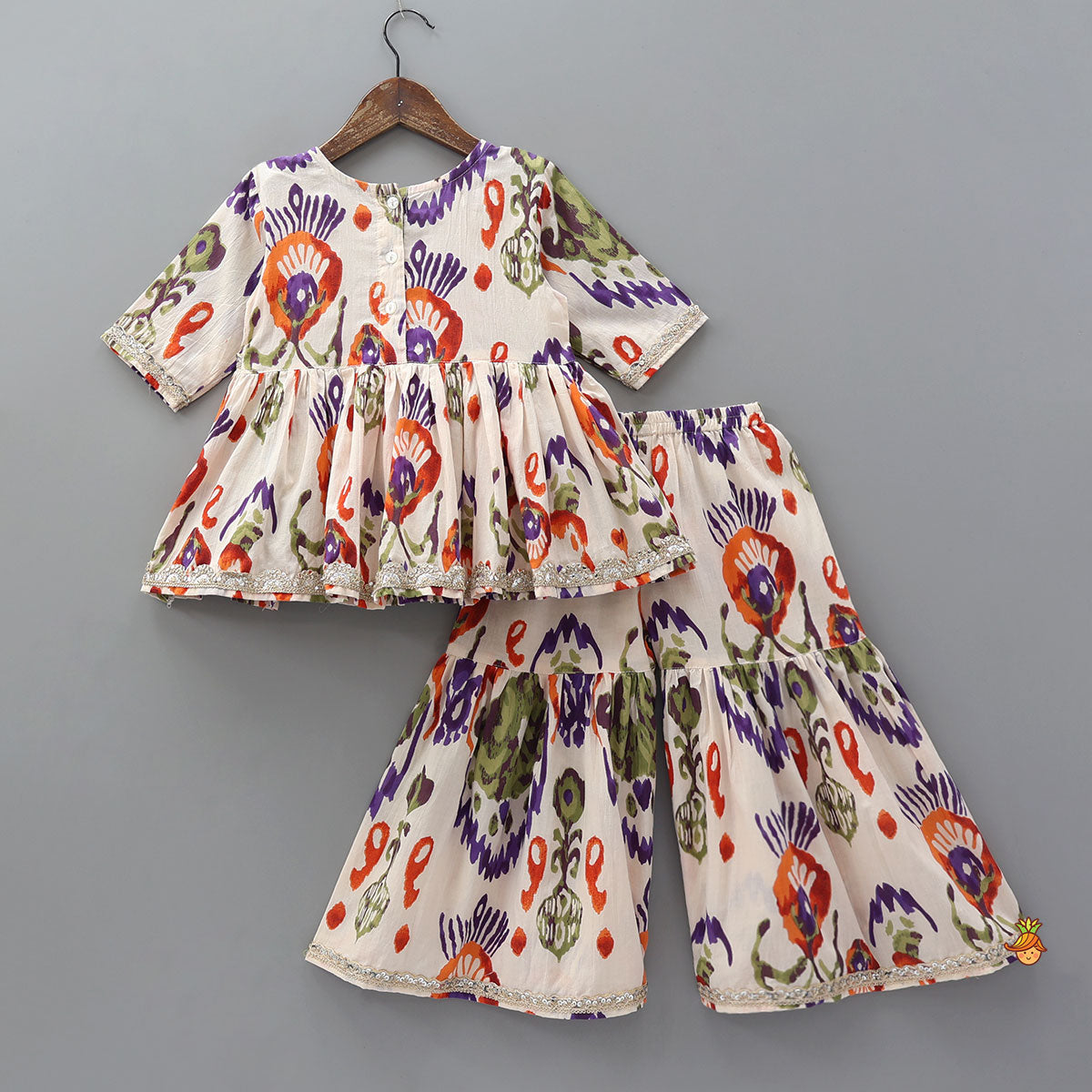 Pre Order: Tassels Enhanced Multicolour Printed Kurti And Sharara With Scalloped Lace Detail Dupatta