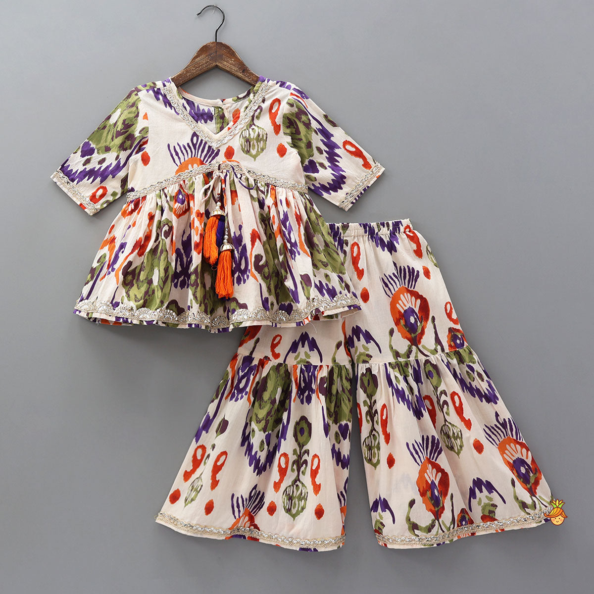 Pre Order: Tassels Enhanced Multicolour Printed Kurti And Sharara With Scalloped Lace Detail Dupatta