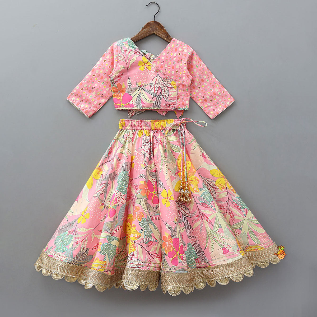 Pre Order: Buttons Adorned Pink Top And Scalloped Lace Work Floral Lehenga