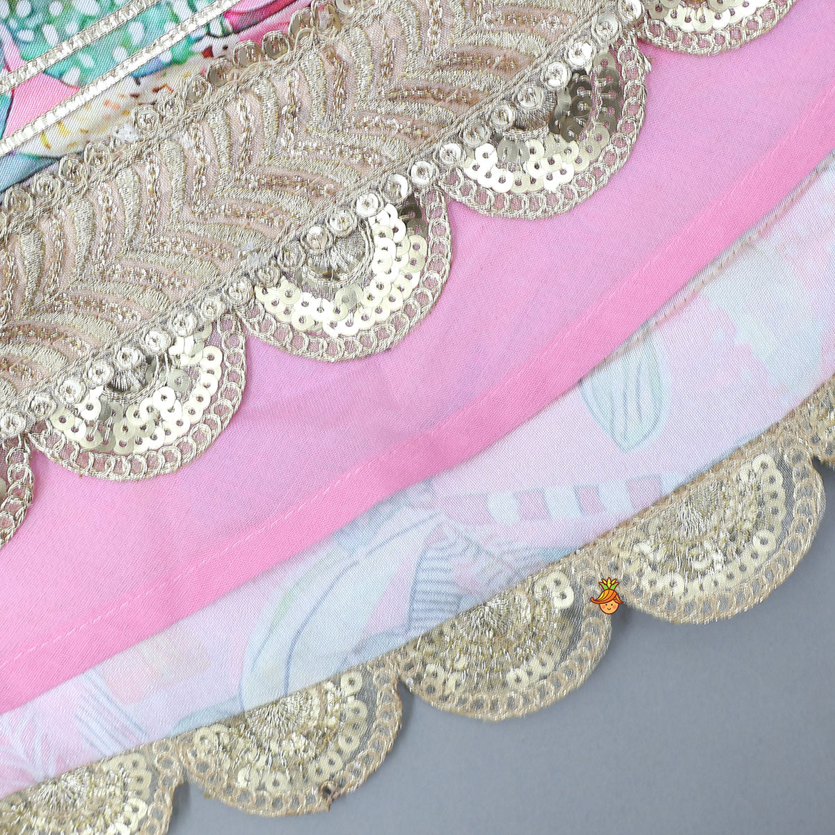 Pre Order: Buttons Adorned Pink Top And Scalloped Lace Work Floral Lehenga