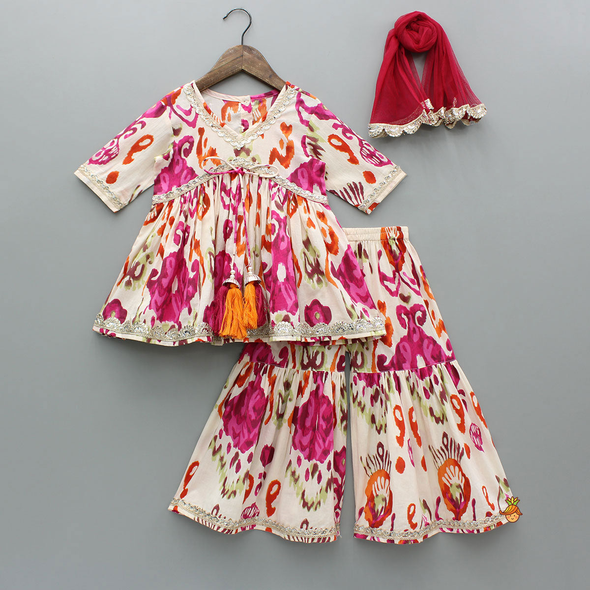 Pre Order: Tassels Enhanced Multicolour Printed Kurti And Sharara With Scalloped Lace Detail Pink Dupatta