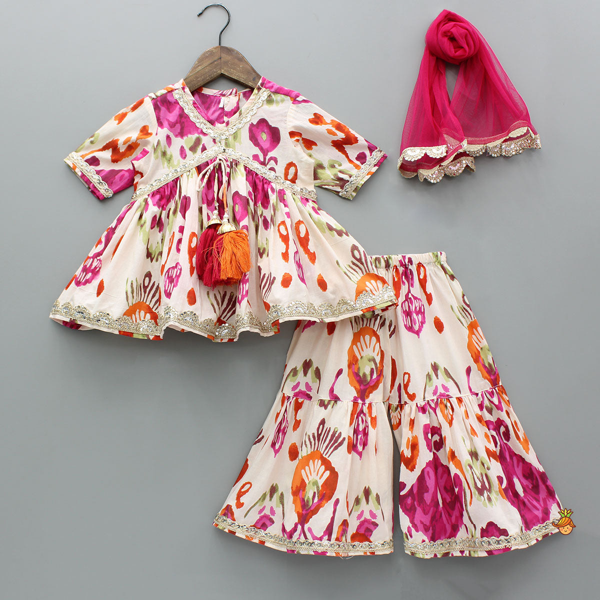 Pre Order: Tassels Enhanced Multicolour Printed Kurti And Sharara With Scalloped Lace Detail Pink Dupatta