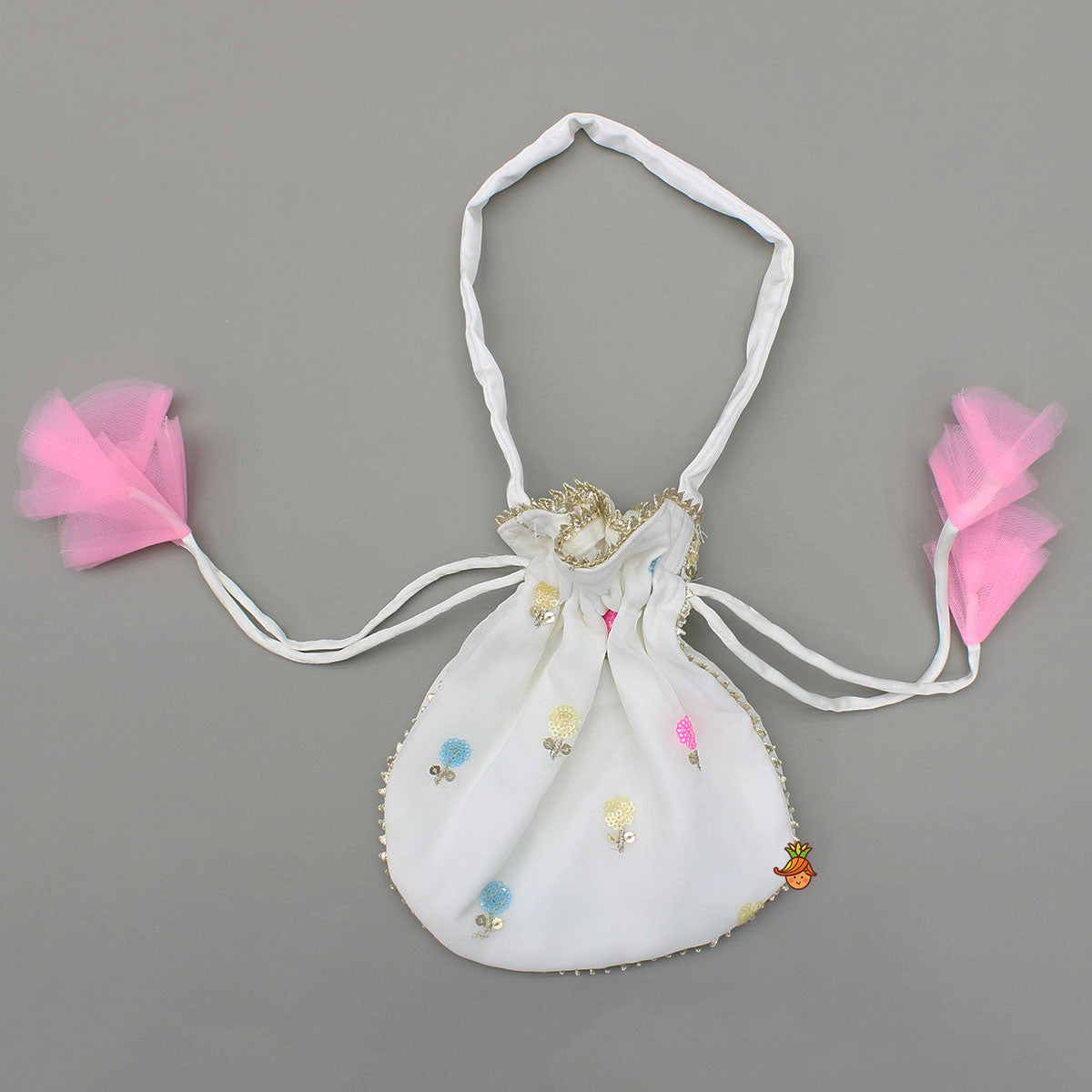Pre Order: Embroidered Off-White Top And Lehenga With Contrasting Pink Net Dupatta And Potli Bag