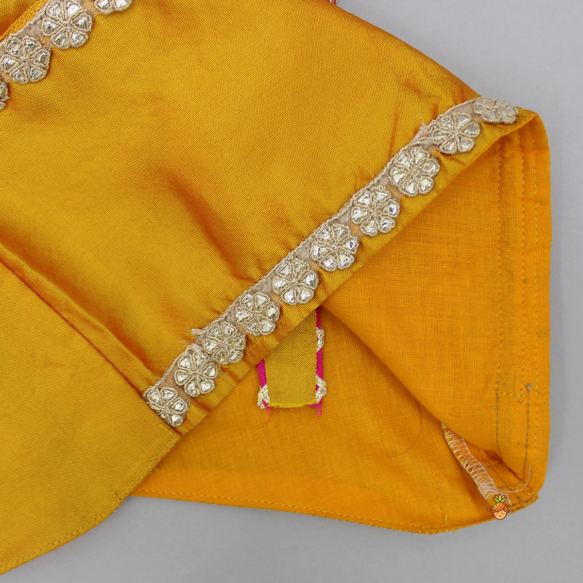 Pre Order: Mustard Top And Ruffle Hem Lehenga With Organza Cape