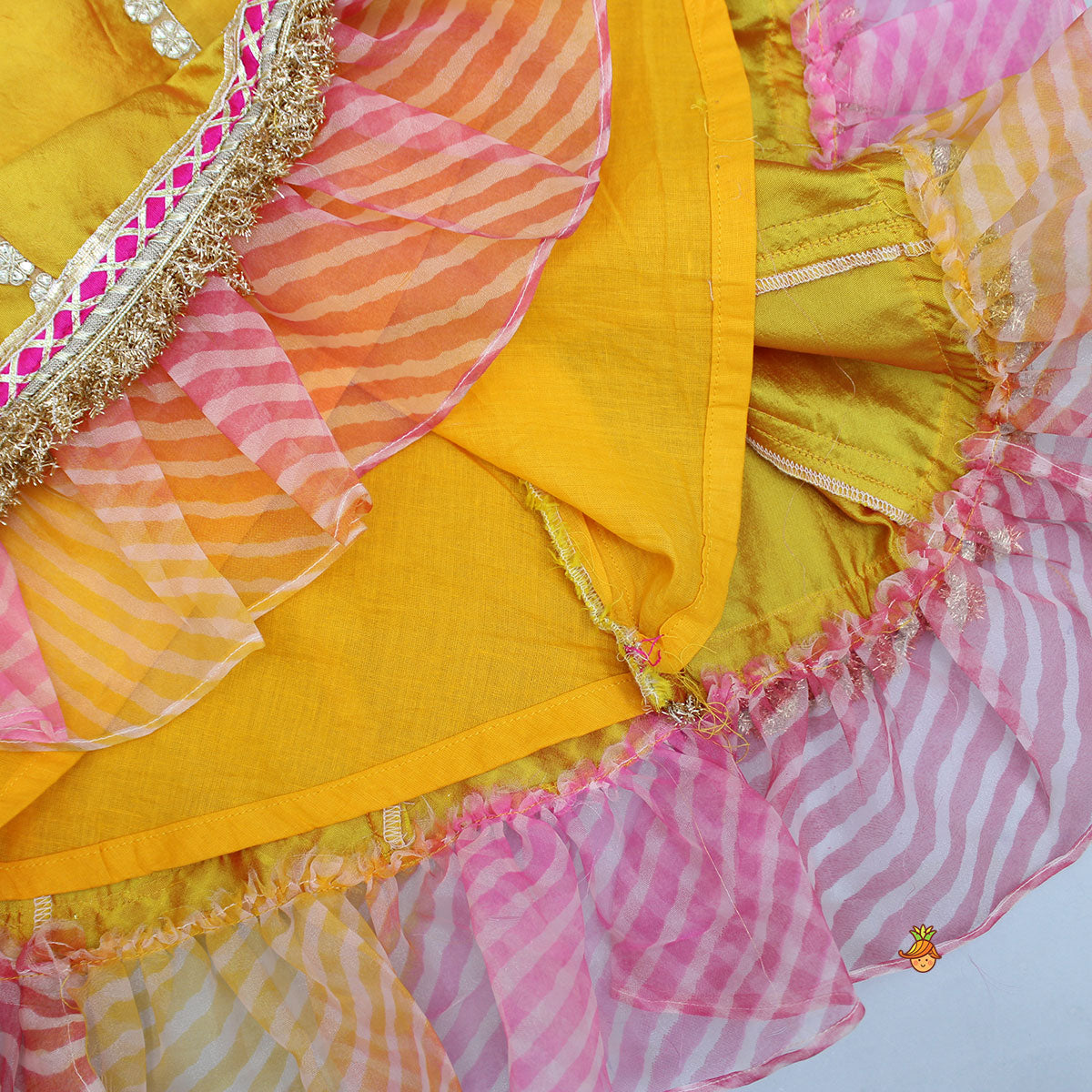 Pre Order: Mustard Top And Ruffle Hem Lehenga With Organza Cape