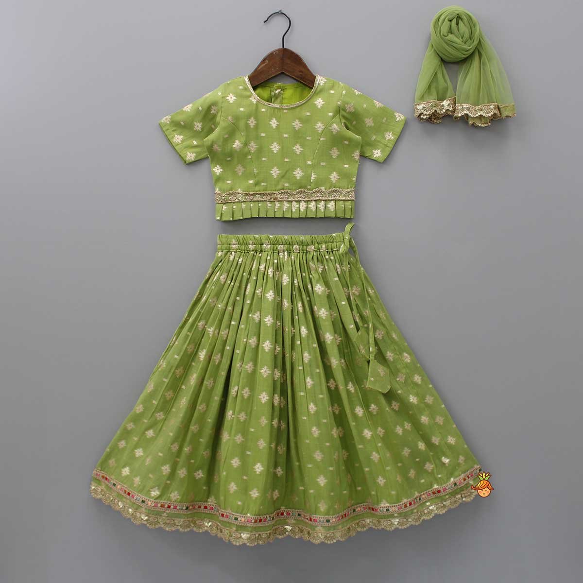 Pre Order: Pleated Hem Green Chanderi Embroidered Top And Lehenga With Net Dupatta