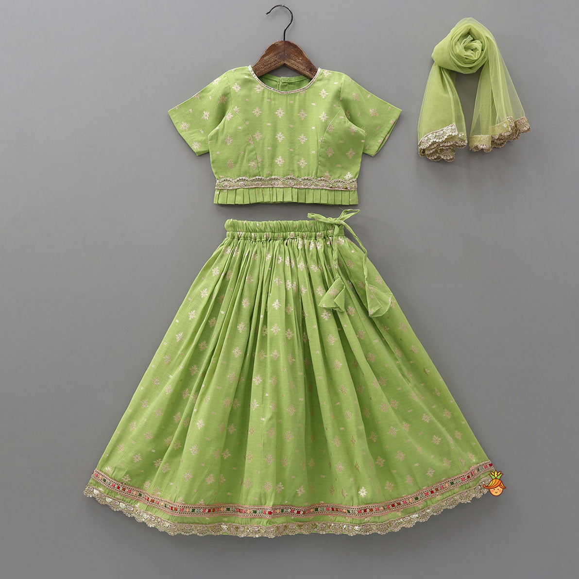 Pre Order: Pleated Hem Green Chanderi Embroidered Top And Lehenga With Net Dupatta