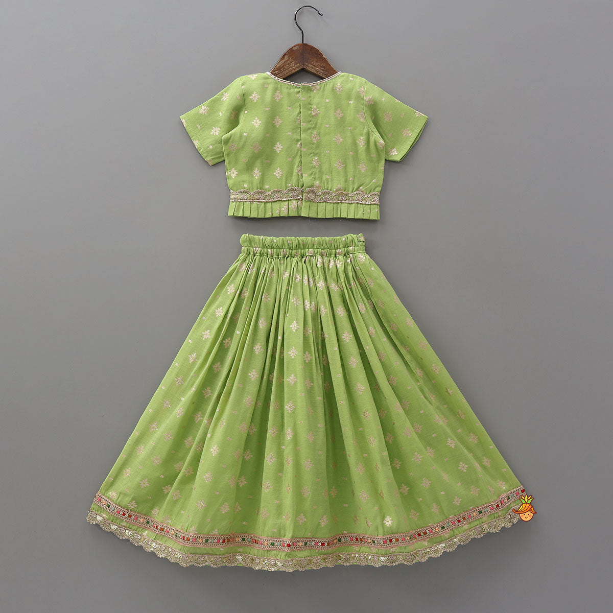 Pre Order: Pleated Hem Green Chanderi Embroidered Top And Lehenga With Net Dupatta