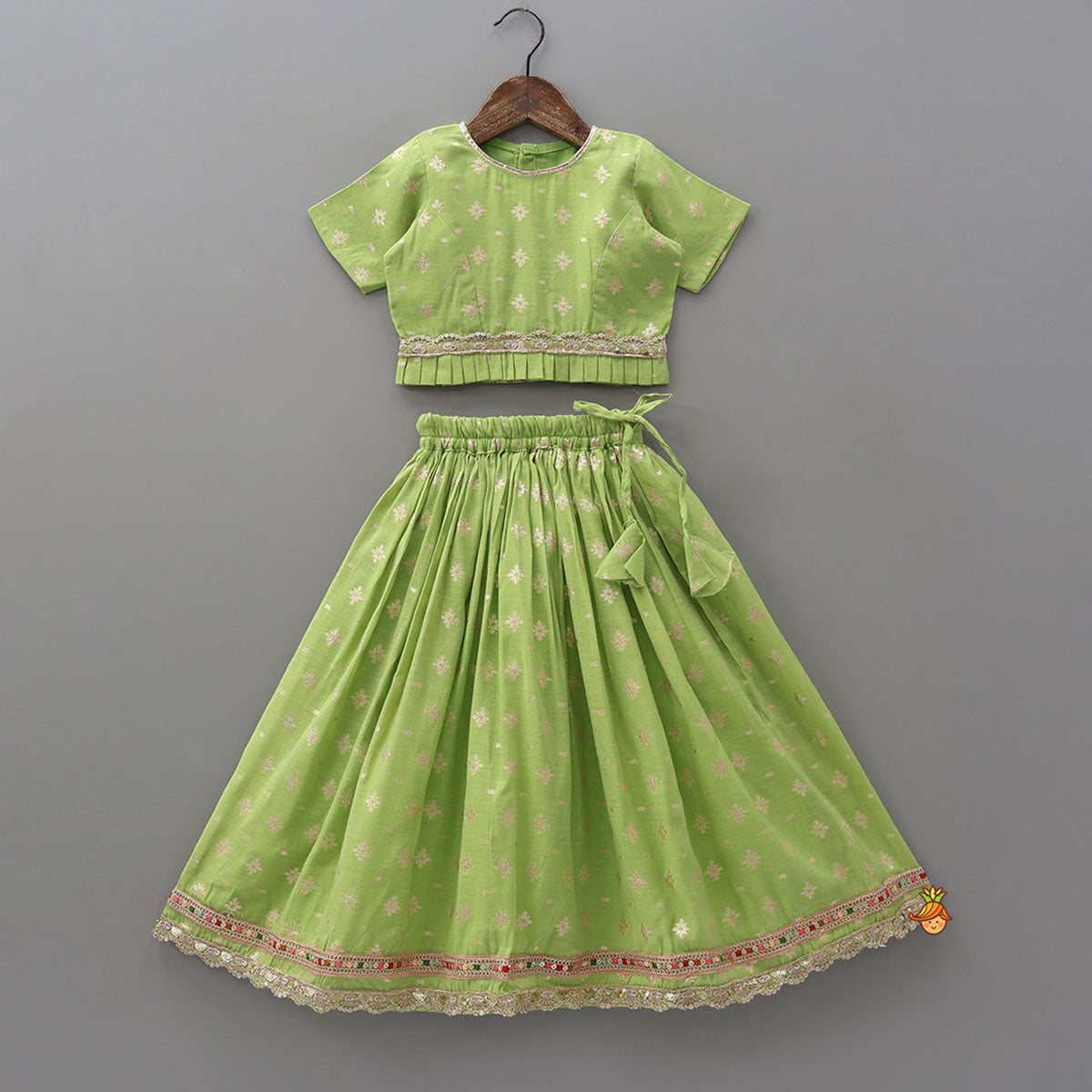 Pre Order: Pleated Hem Green Chanderi Embroidered Top And Lehenga With Net Dupatta
