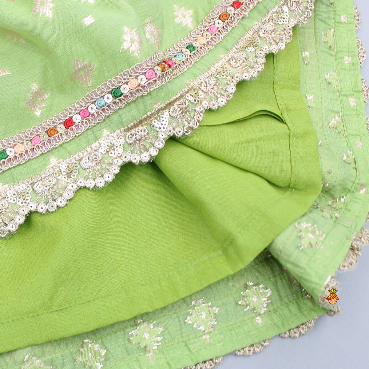 Pre Order: Pleated Hem Green Chanderi Embroidered Top And Lehenga With Net Dupatta