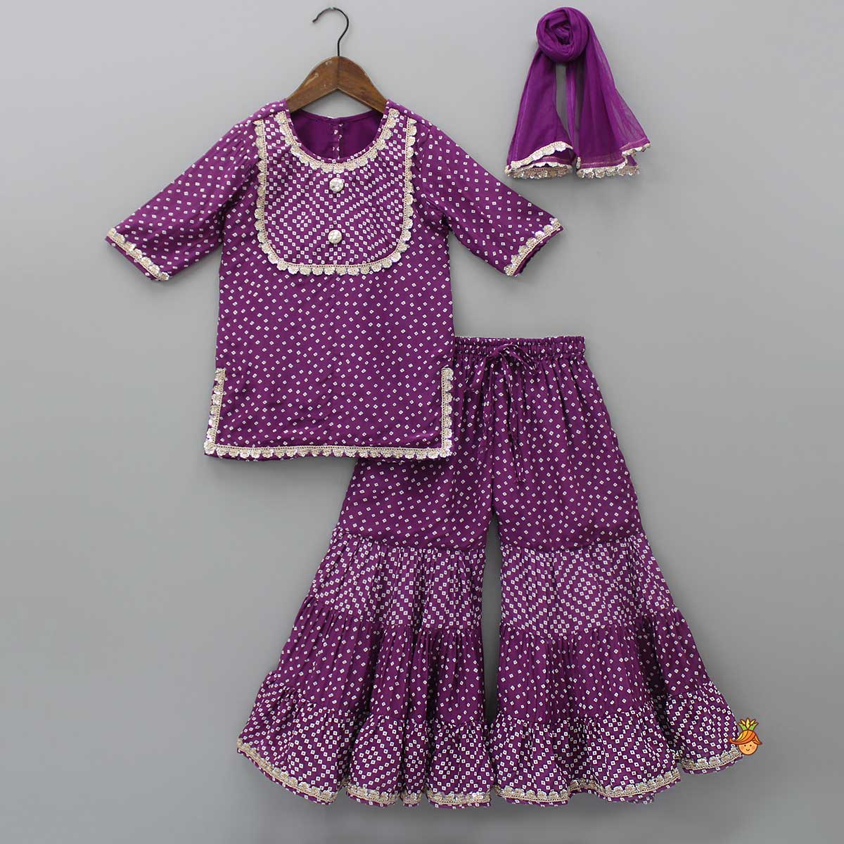 Pre Order: Purple Bandhani Printed Kurti And Tiered Sharara With Matching Net Dupatta