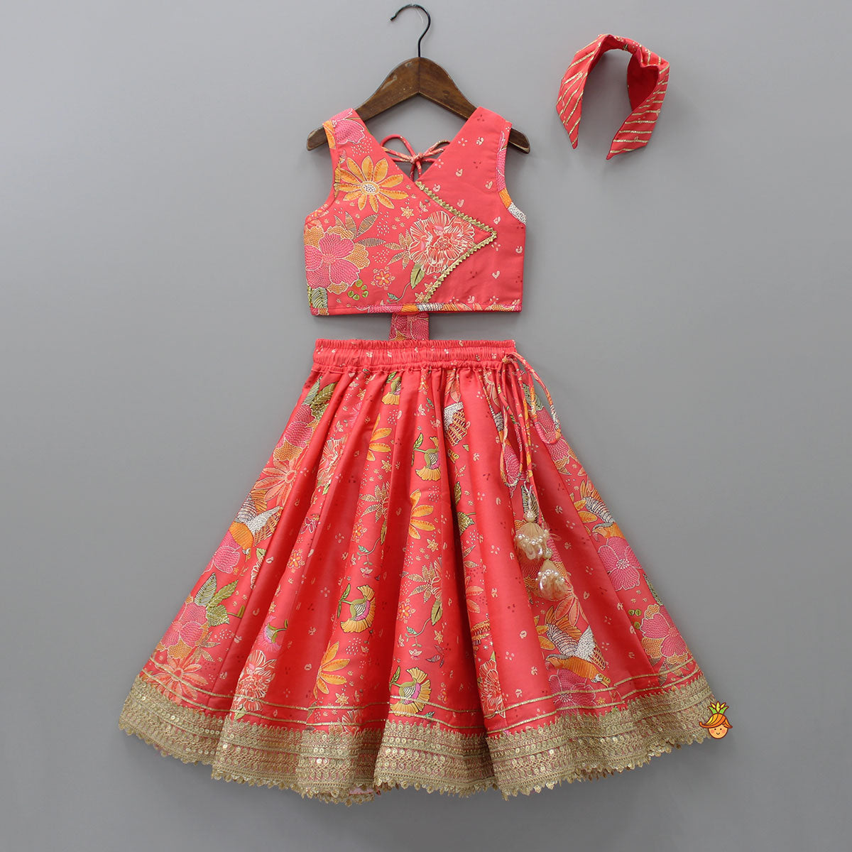 Pre Order: V Neck Peach Top And Printed Lehenga With Hair Band