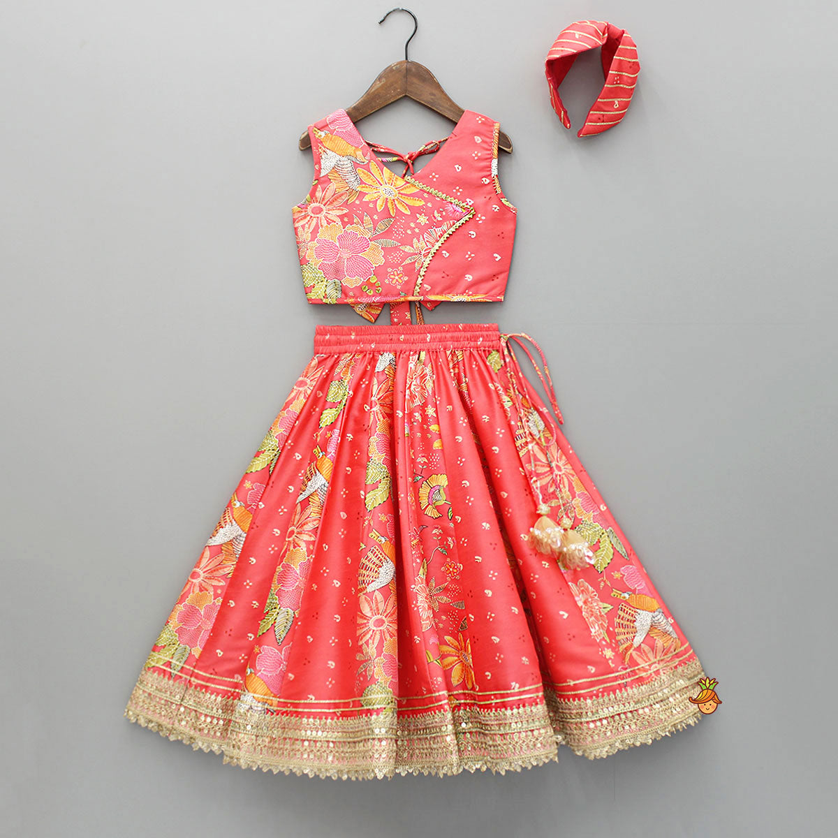 Pre Order: V Neck Peach Top And Printed Lehenga With Hair Band