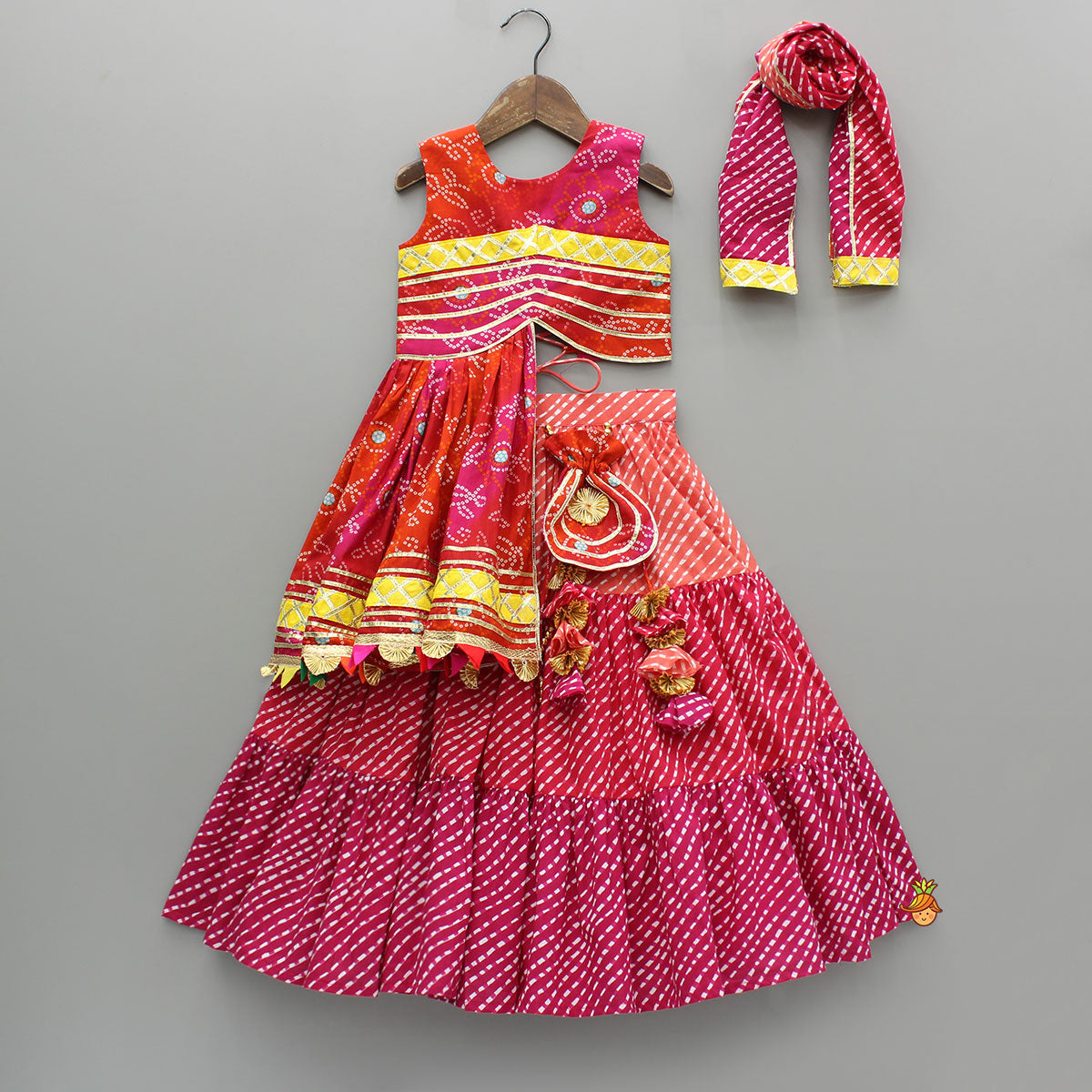 Pre Order: Printed Stylish Kurti And Lehenga With Attached Matching Potli And Dupatta