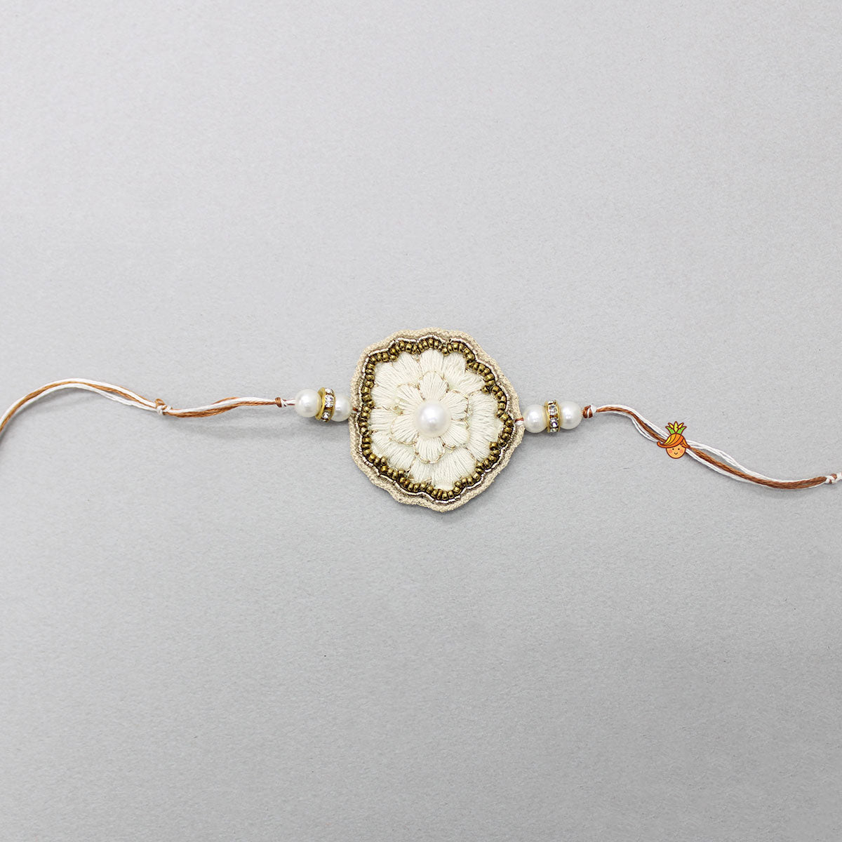 Hand Embroidered Rakhi With Flower Design