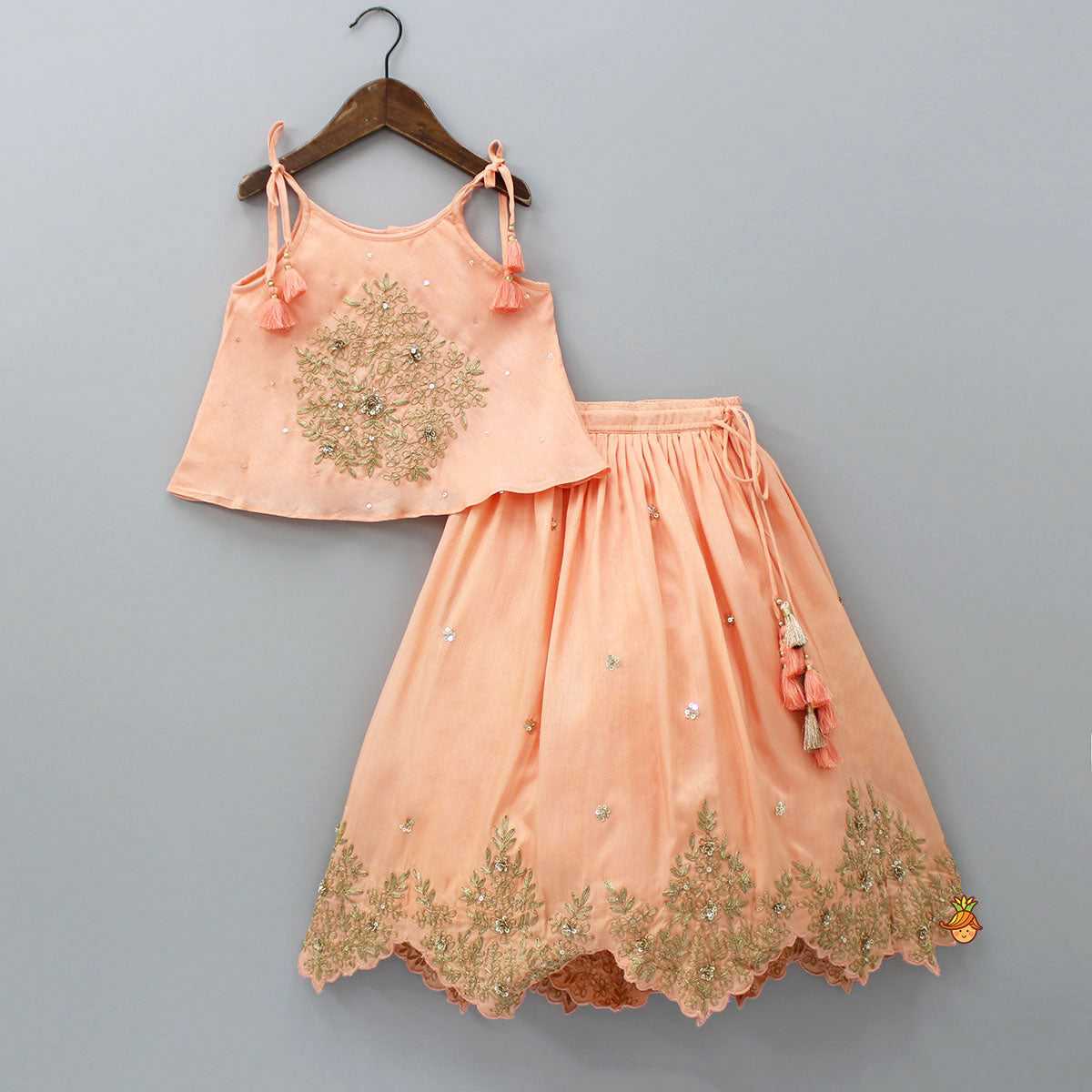 Pre Order: Embroidered Peach Tie-Up Strap Top And Pleated Lehenga