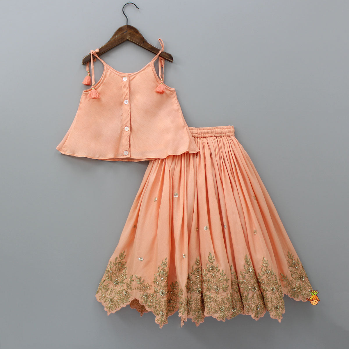 Pre Order: Embroidered Peach Tie-Up Strap Top And Pleated Lehenga