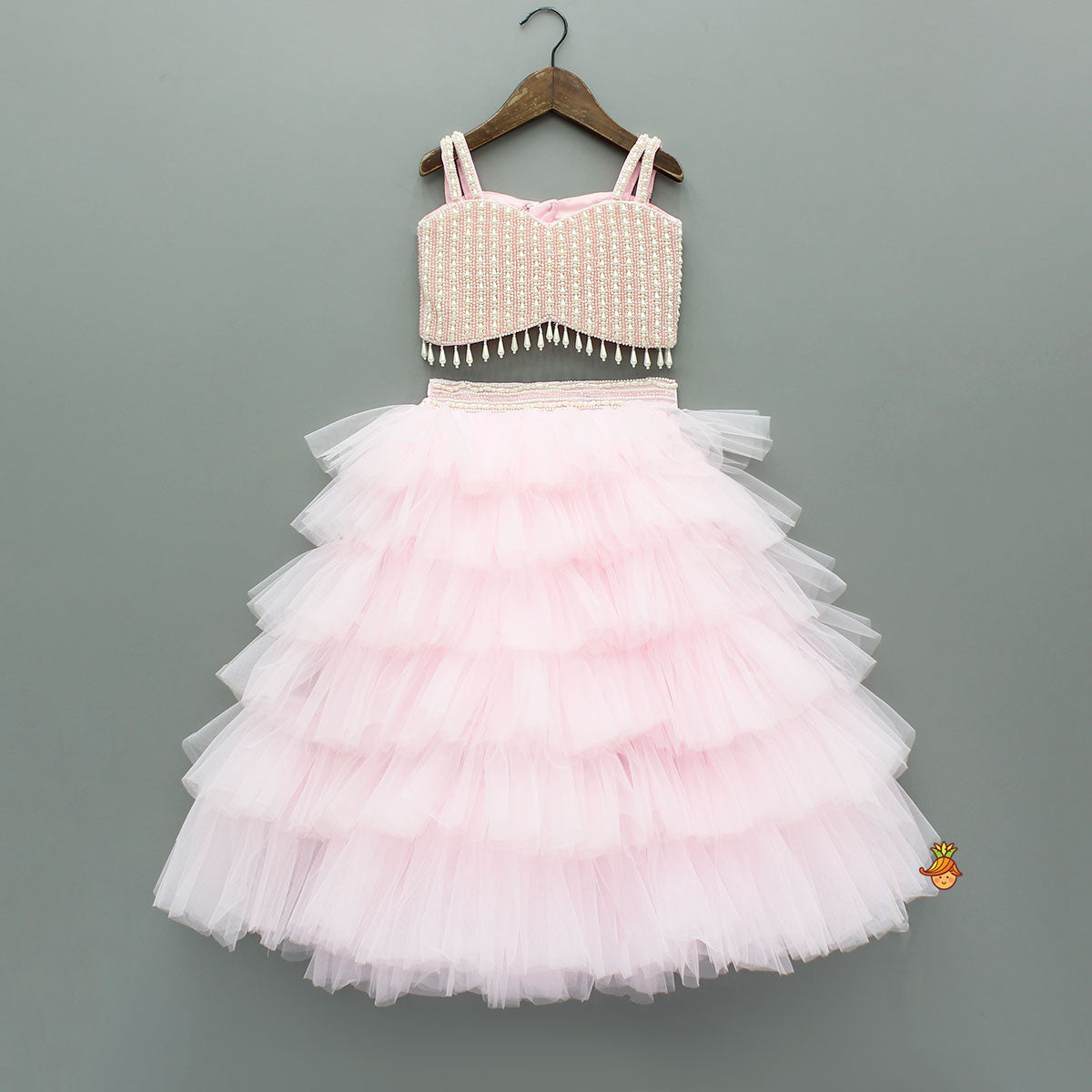 Pre Order: Pink Stylish Strappy Top And Ruffle Net Lehenga