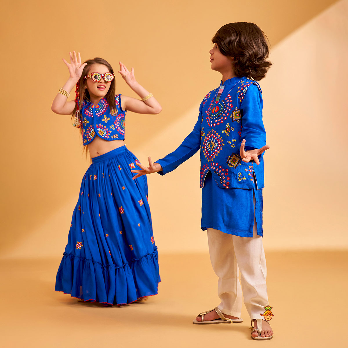 Embroidered Blue Top And Flared Lehenga twinning model image 1