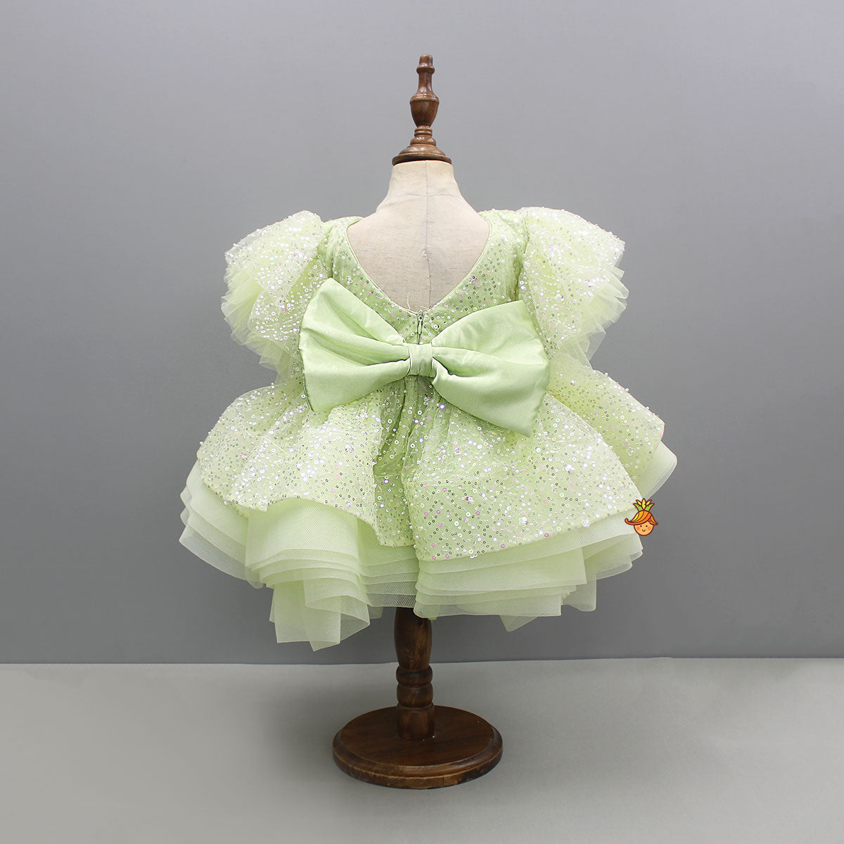 Pre Order: Green Sequin Embellished Dress Featuring Detachable Trail And Bow Paired With Swirled Bow Hairclip