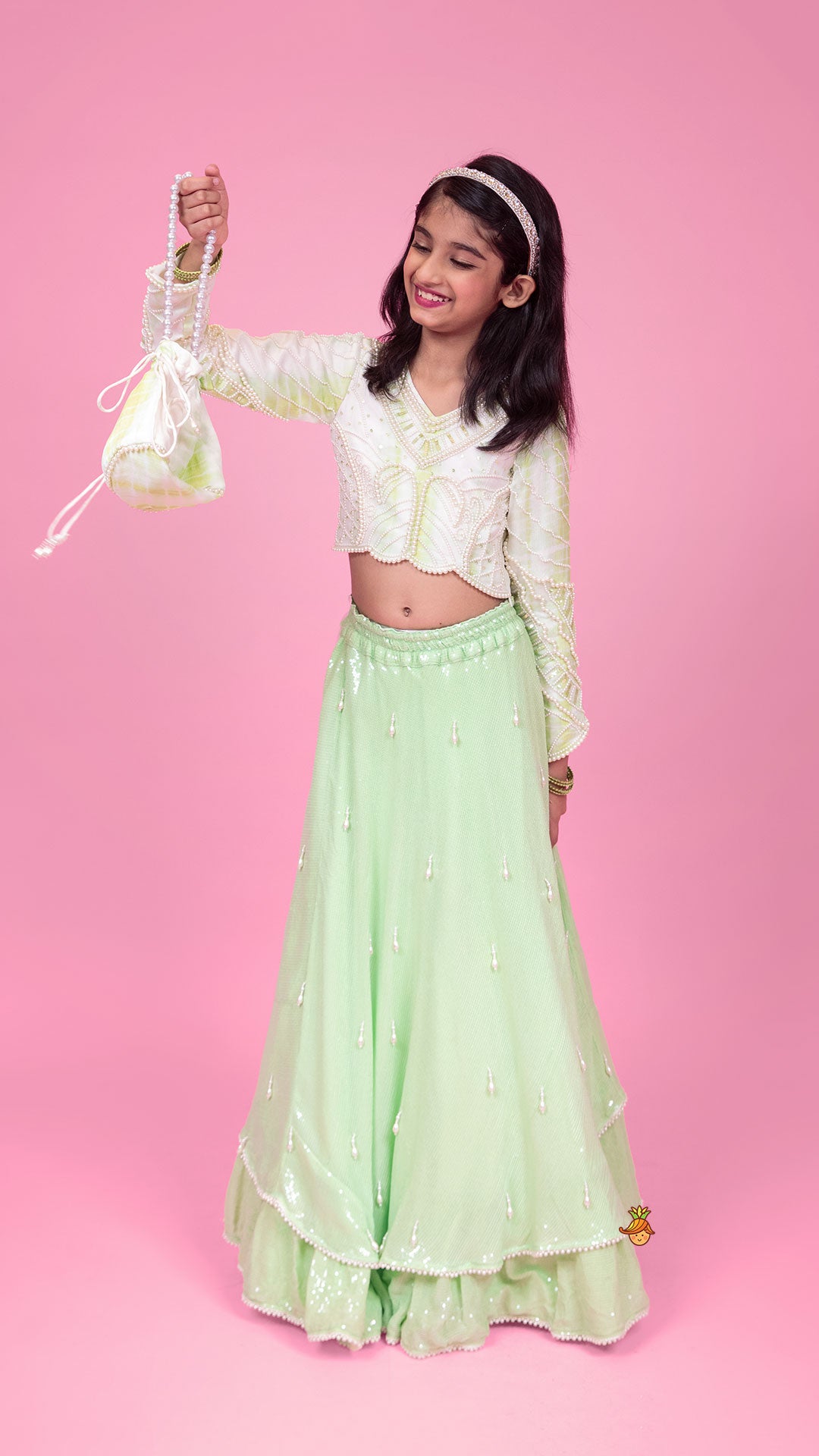 Pre Order: Dual Tone Embellished Embroidered Top And Green Lehenga With Matching Potli Bag