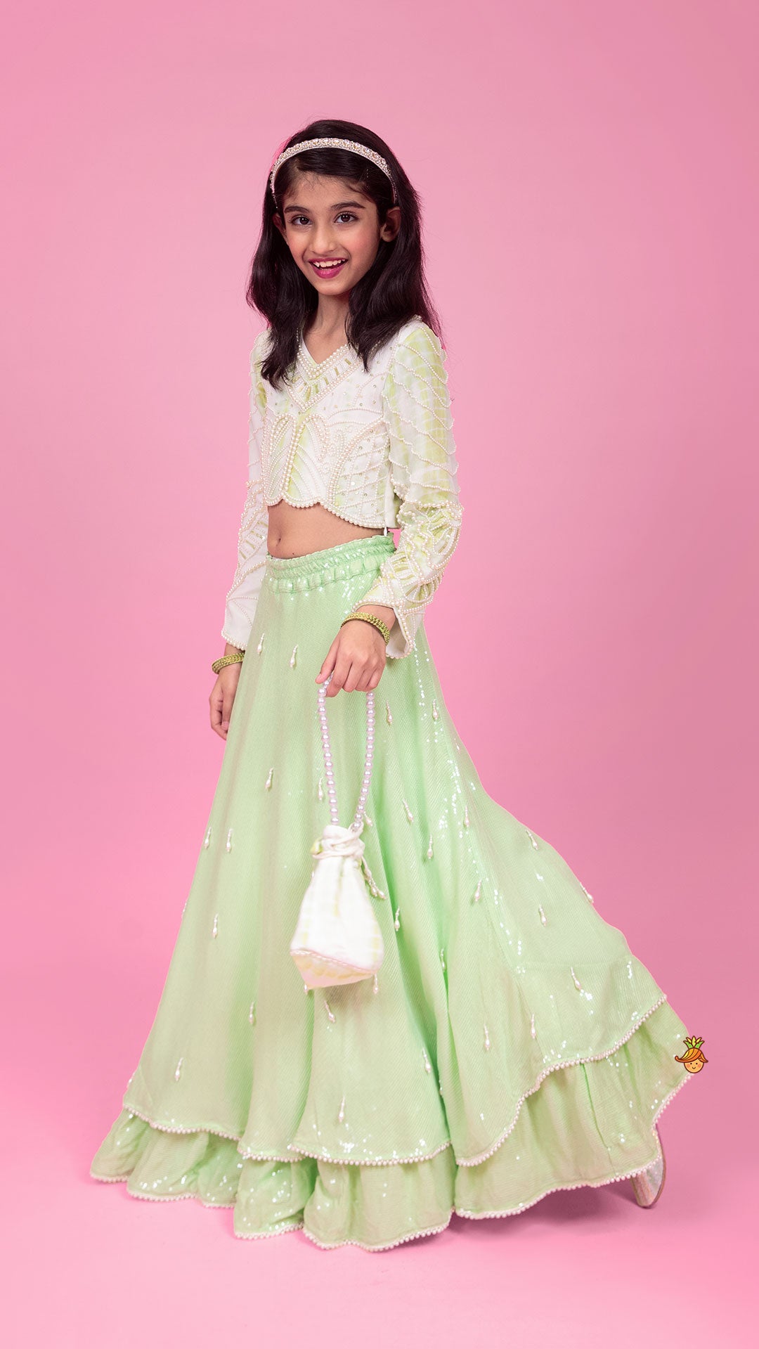 Pre Order: Dual Tone Embellished Embroidered Top And Green Lehenga With Matching Potli Bag