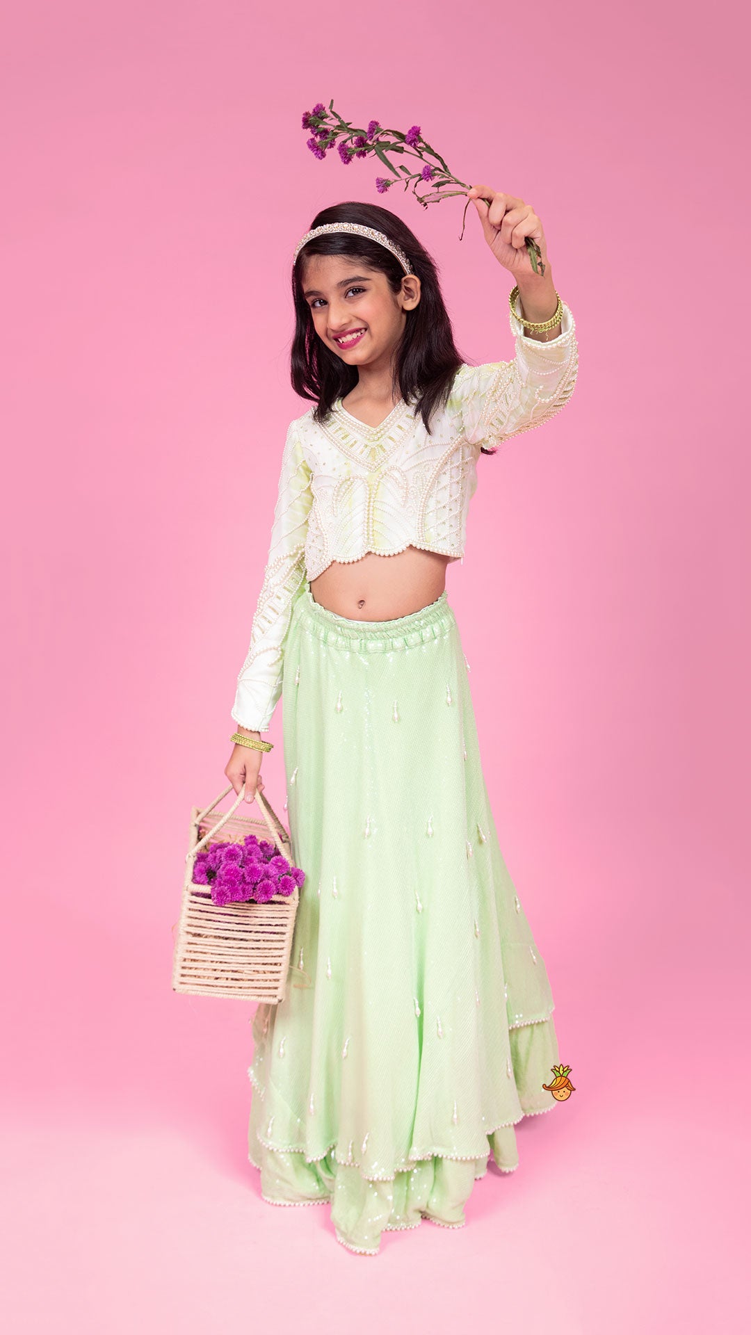 Pre Order: Dual Tone Embellished Embroidered Top And Green Lehenga With Matching Potli Bag