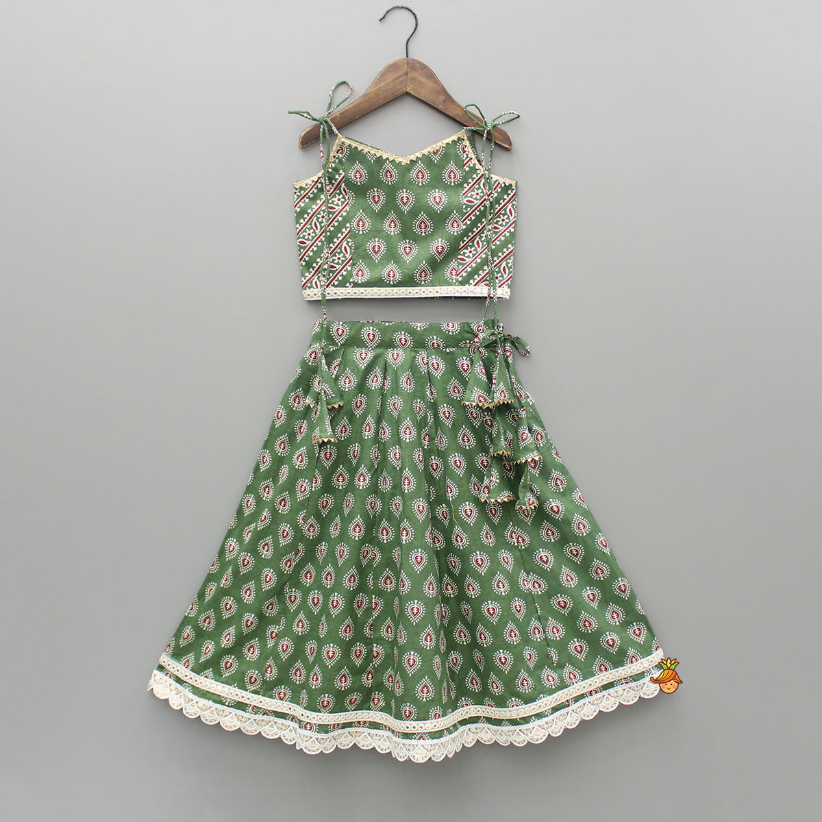 Pre Order: Green Printed Tie Up Strap Top And Lehenga