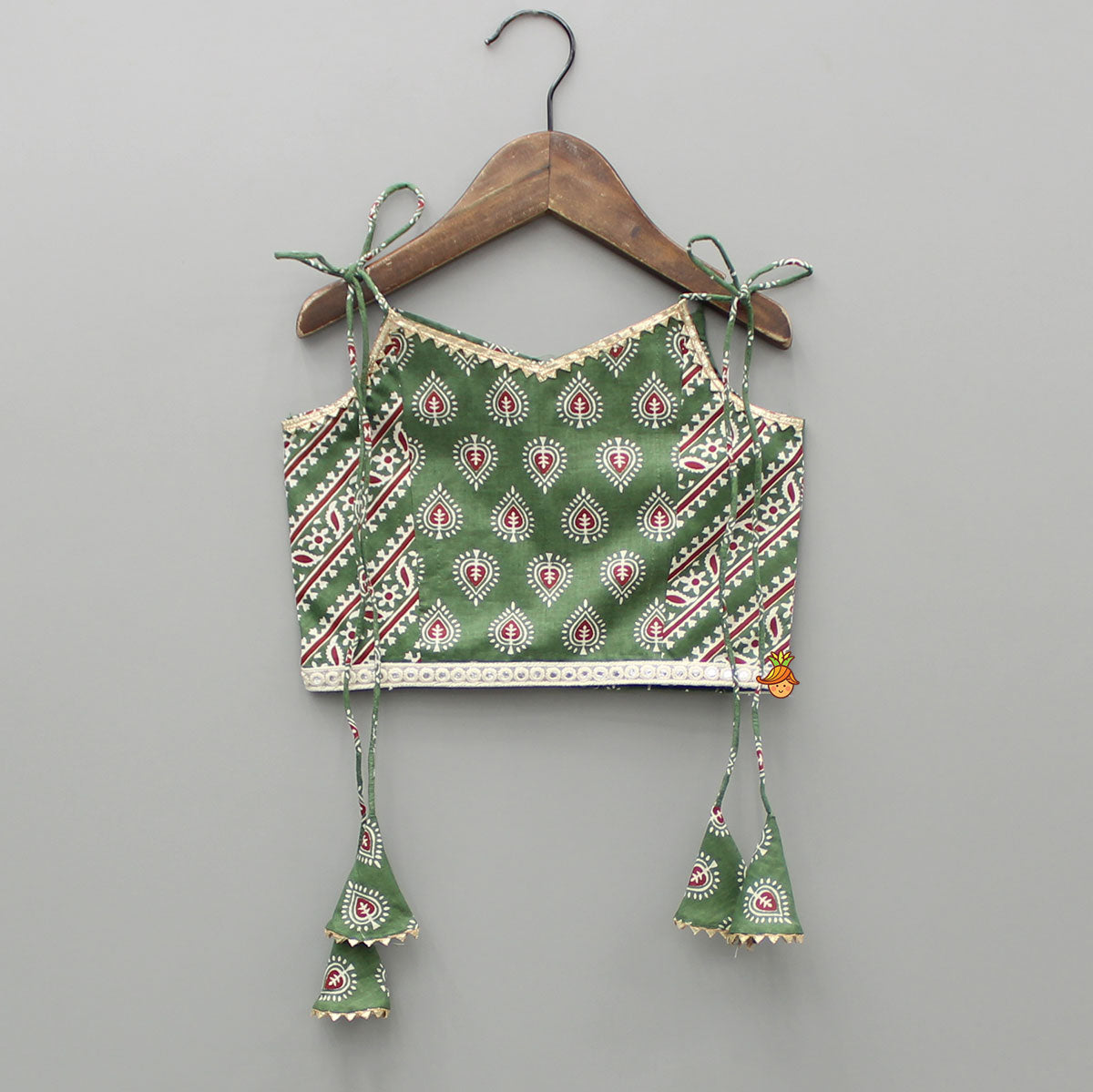 Pre Order: Green Printed Tie Up Strap Top And Lehenga