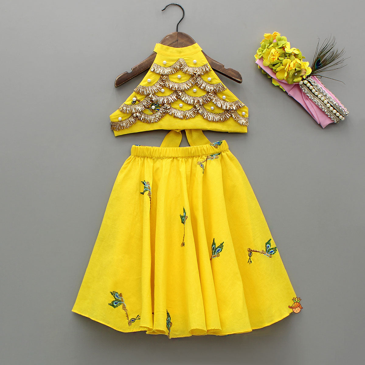 Pre Order: Yellow Embroidered Embellished Halter Neck Top And Lehenga With Head Band