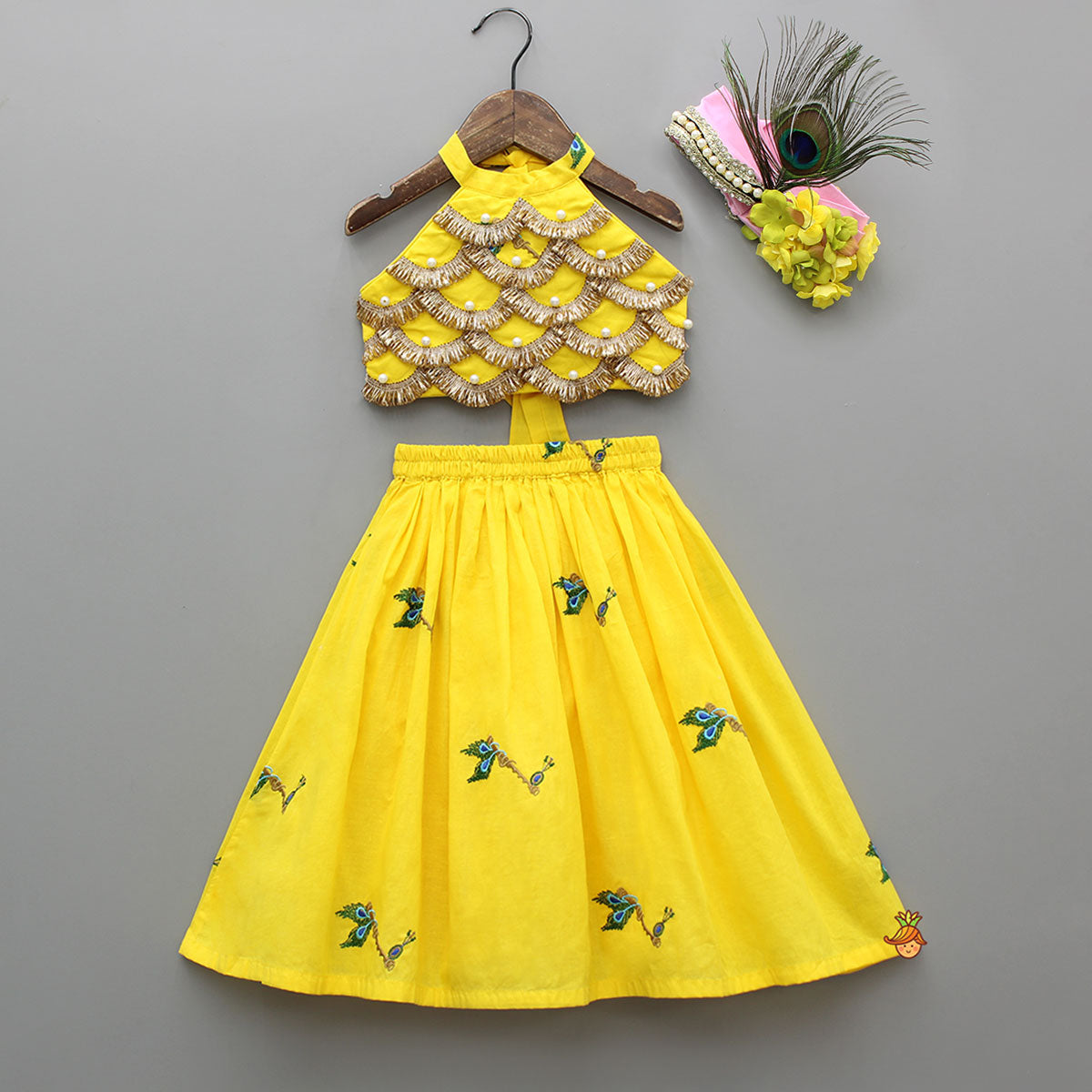 Pre Order: Yellow Embroidered Embellished Halter Neck Top And Lehenga With Head Band