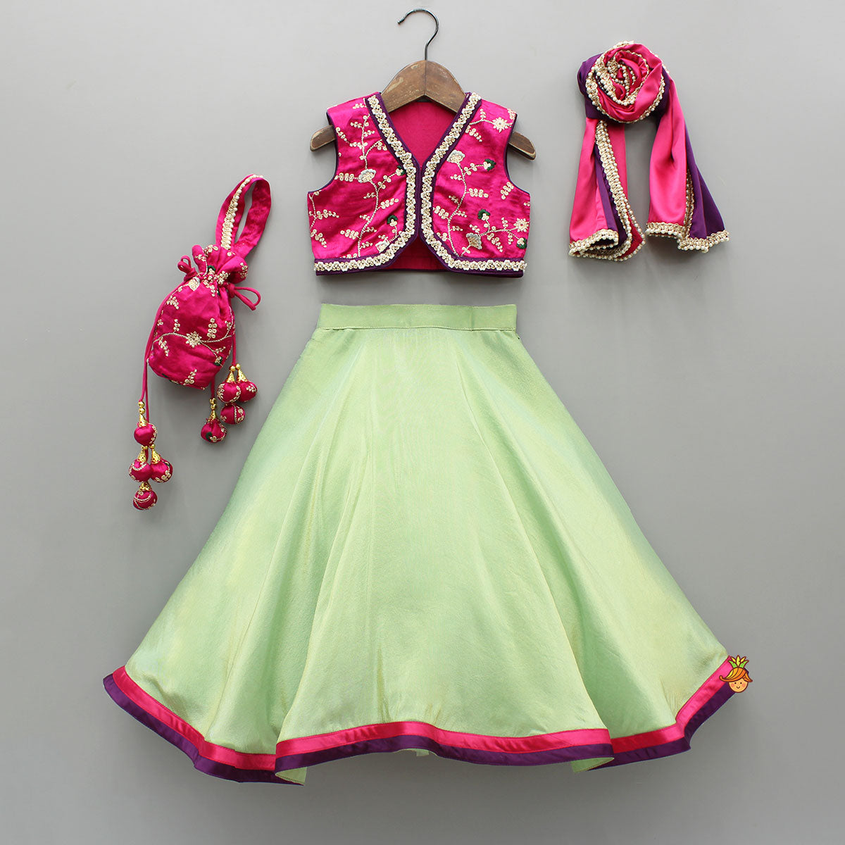 Pre Order: Pink Embroidered Top And Green Lehenga With Dupatta  And Matching Potli Bag